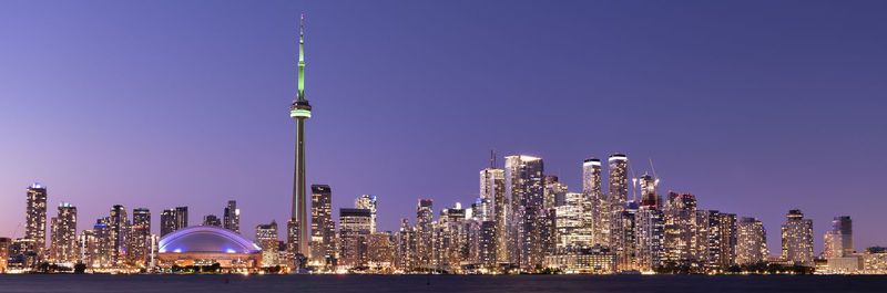 Illuminated buildings in city at night