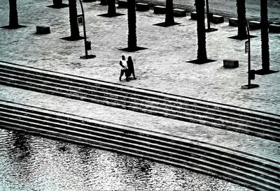 Low section of people walking on steps