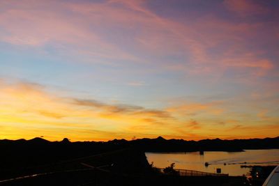 Scenic view of sea against orange sky