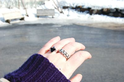 Close-up of cropped woman hand showing rings