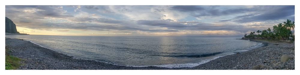 Panoramic view of sea against sky during sunset