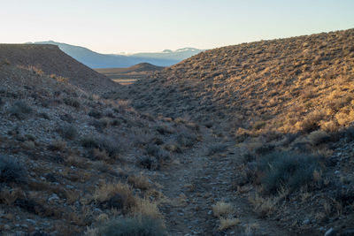 Scenic view of arid landscape against sky