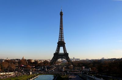 Tower in city against clear sky