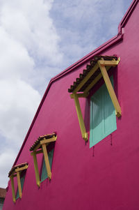 Low angle view of multi colored building against sky