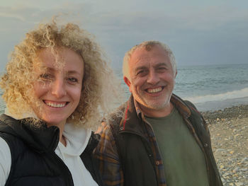 Portrait of smiling young man at beach