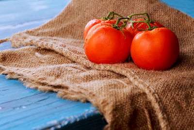 Tomatoes on burlap over table