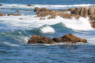 Scenic view of rocks in sea