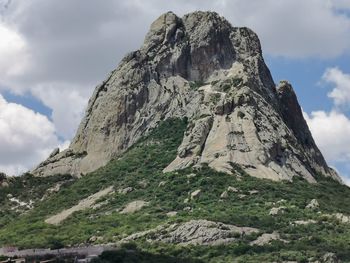 Low angle view of rocks on land against sky