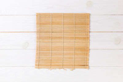 High angle view of wooden planks on white background