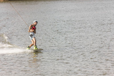 Full length of man jumping in sea