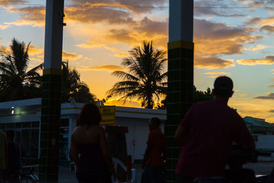 Silhouette of people at sunset