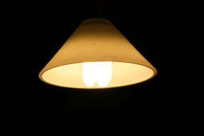 Low angle view of illuminated electric lamp