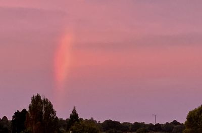 Scenic view of rainbow against sky during sunset