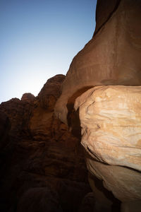 Low angle view of rock formation against clear sky