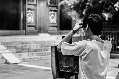 Young man holding camera