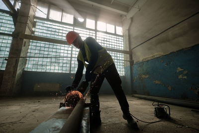 Man working in abandoned building