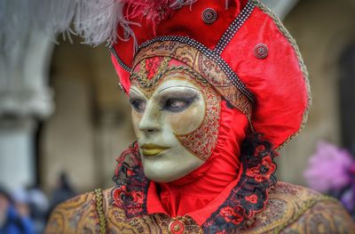 Close-up of person wearing mask standing outdoors