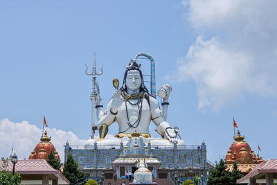 Low angle view of statue against sky