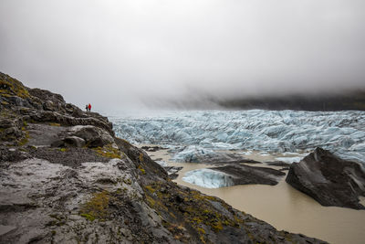 Scenic view of glacier against sky