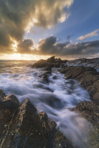 Scenic view of sea against sky during sunset