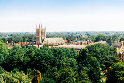 High angle view of trees and buildings in city