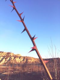 Low angle view of wind turbine against clear sky