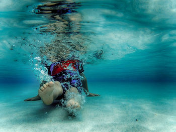 Woman swimming in sea