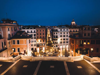 Illuminated buildings in city at night