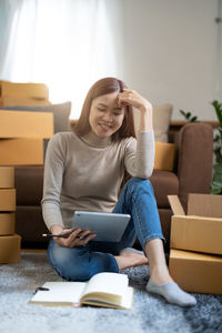 Young woman using laptop at home