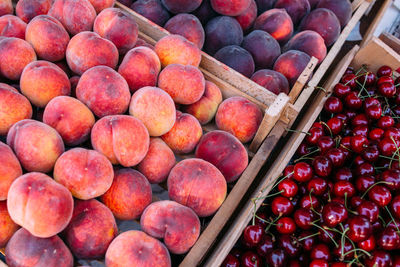 Fresh ripe fruits on the market in boxes