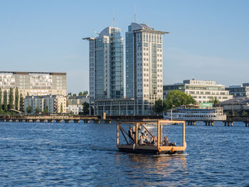 View of buildings at waterfront at river spree in friedrichshain, berlin