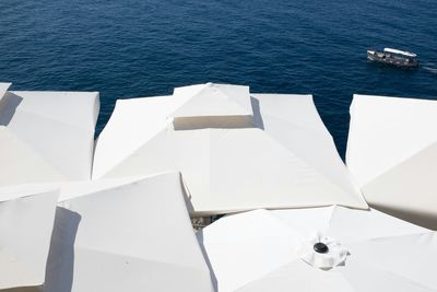 High angle view of sunshades at seaside