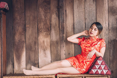 Portrait of young woman sitting outdoors