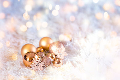 Close-up of christmas ornaments on fur