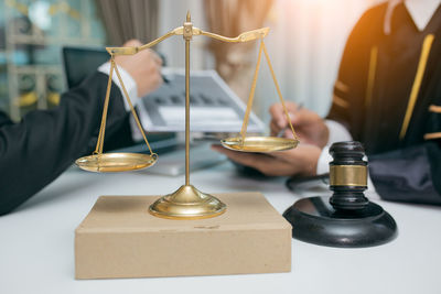 Close-up of candles on metal