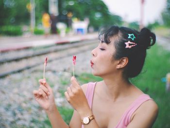 Close-up of woman playing with pinwheel toy