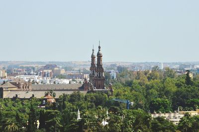 Panoramic view of buildings in city against clear sky