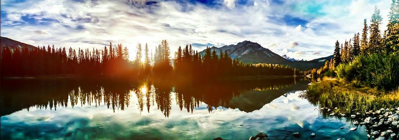 Scenic view of lake against cloudy sky
