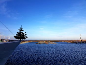 Scenic view of sea against blue sky