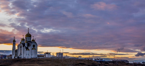 View of buildings against sky during sunset