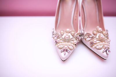 High angle view of wedding rings on white background
