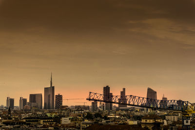 Cityscape against sky during sunset