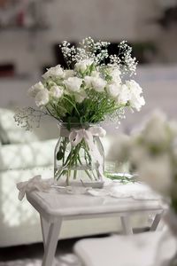 Close-up of white flower vase on table