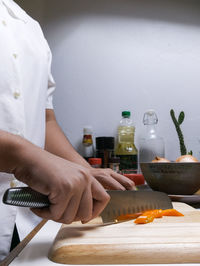 Close-up of person preparing food on table