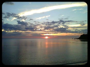 Scenic view of sea at sunset