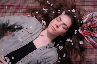 Portrait of woman lying on floor