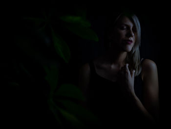 Portrait of young woman looking away