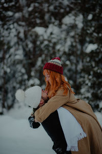 Woman with umbrella in winter