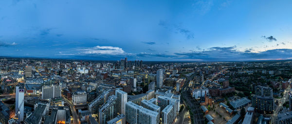 Aerial view of cityscape against sky