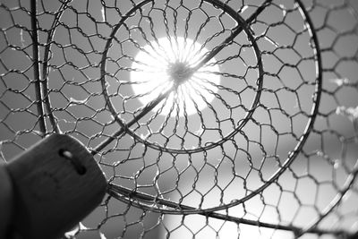 A downward sprial. low angle view through a metallic object.